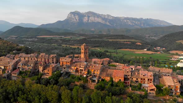 Ainsa, Spain. Flying Over Ainsa Village in Aragon Mountains. Aerial View, FHD