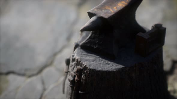 Old Anvil Attached To a Stump