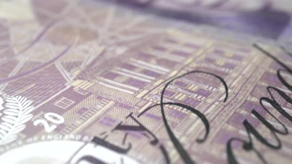 Fifty British Pound paper banknote in close up macro view dolly shot.