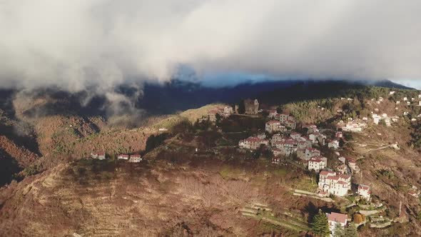 Bajardo village town in mountain countryside aerial view. Baiardo landscape in Liguria Italy.