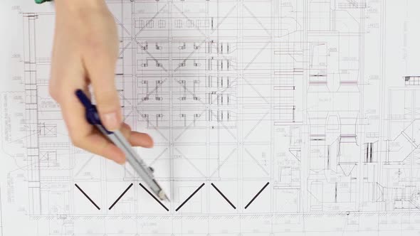 Designer Corrects Errors Made in the Drawn Drawings. Close Up