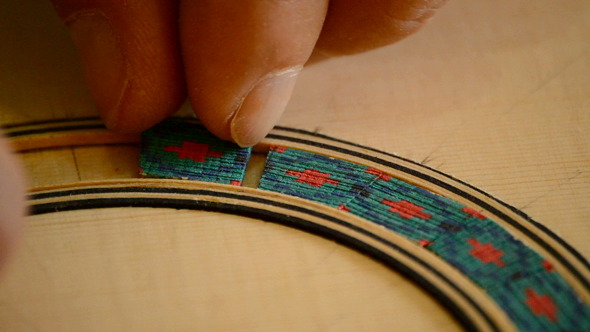 Luthier Decorates Handmade Guitar