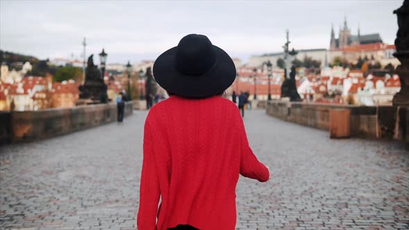 Beautiful Asian Japanese Woman Blows Kiss While Walking Around Old Town Prague