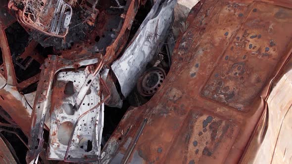 Vertical Video of a Dump of Cars Destroyed By the War in Ukraine