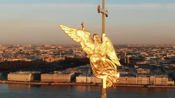 Flying Around an Angel on Spire of Peter and Paul Fortress at Sunset
