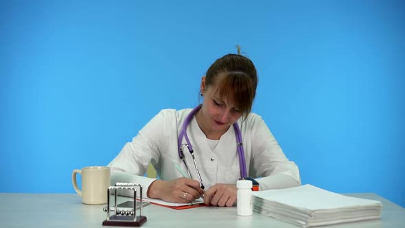 Young Doctor Novice Fills Out Paperwork