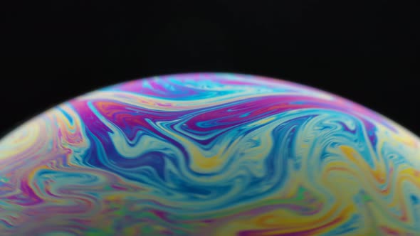Psychedelic Abstract Planet From Soap Bubble on Black Background