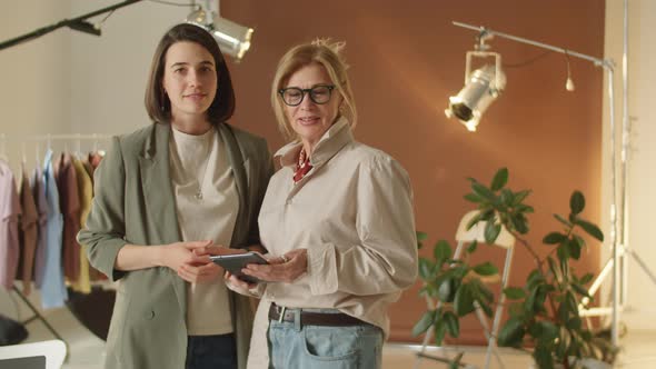 Portrait of Senior and Young Businesswomen at Work in Photo Studio