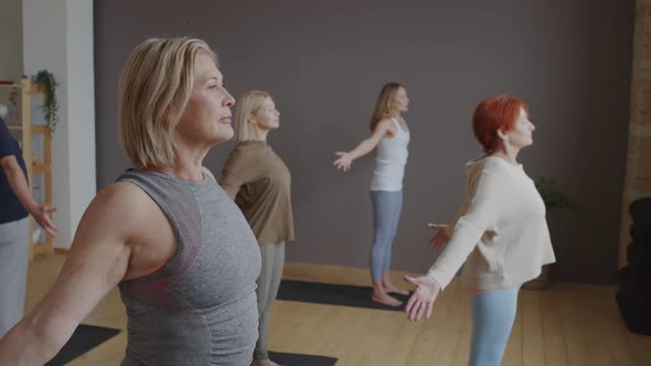 Older People Working Out in Yoga Class