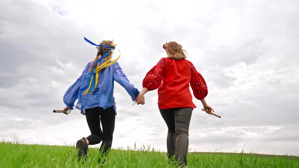 Happy Women Running Holding Flute  Ukrainian Sopilka in Hands