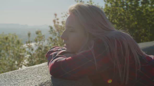 Pensive Cute Woman Enjoying Sunshine and Nature at Dawn