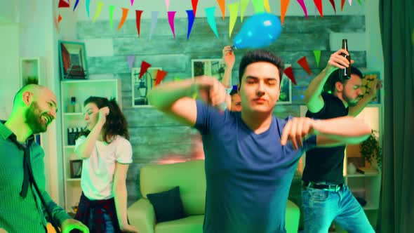 Excited Young Man Partying with His Friends