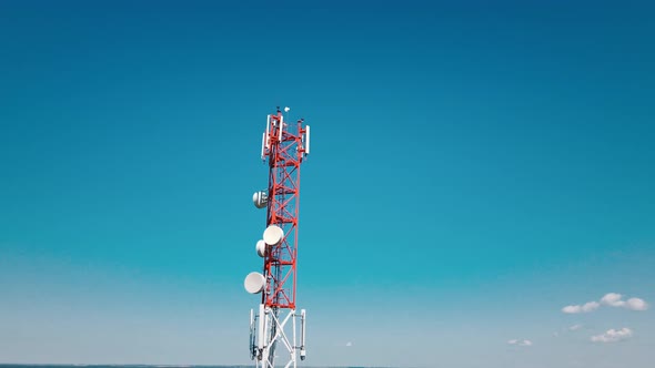 Aerial View of 4G and 5G Cell Tower with Antennas and Satellites