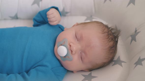 Mommy Rocks Cot with Newborn Child Sleeping in Soft Cocoon