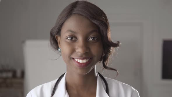 Portrait of a Young Smiling Black African American Doctor Woman Girl