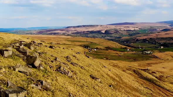 Aerial footage with village in the background. Marsden Moor, Peak District National Park, United Kin