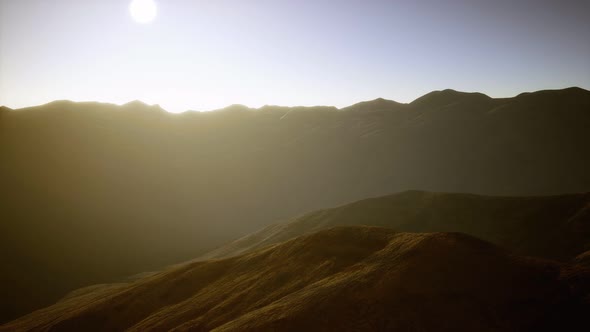 Hills with Rocks at Sunset