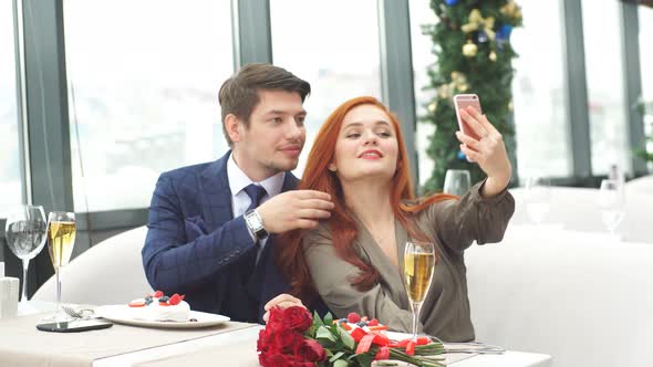 Romantic Pastime of Young Caucasian Couple in Restaurant.