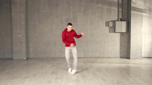 Teenage Boy in Red Sweater Is Dancing Hip Hop