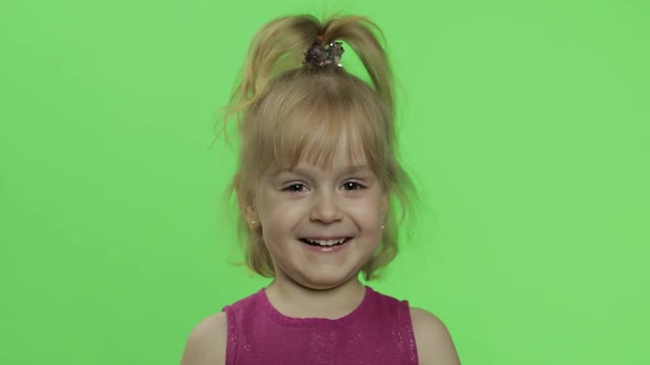 Child Portrait in Purple Dress. Happy Four Years Old Girl Laughing. Chroma Key