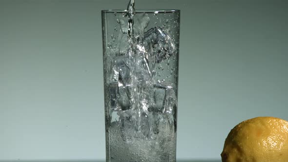 Carbonated liquid pouring into glass filled with ice - ultra slow mo 1500fps - LIQUID POUR 