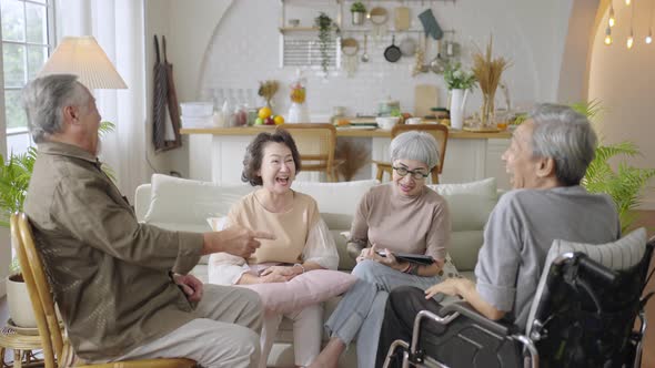 Group Asian seniors friends enjoying talking together.