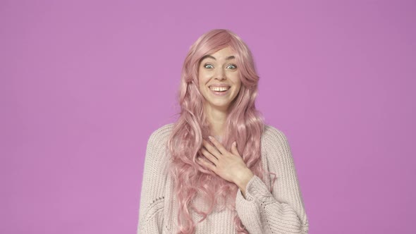 Slowmotion Surprised and Happy Cheerful European Woman in Pink Wig Hearing Something Hilarious