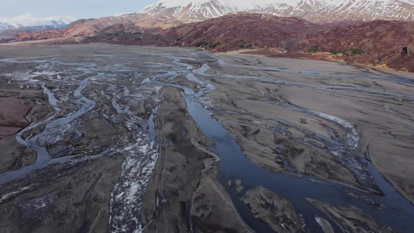 Drone Over Hvannagil Canyon And Estuary Towards Mountains