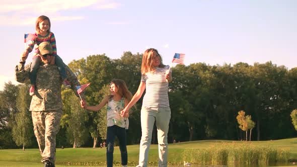 US Army Soldier with Family in Park