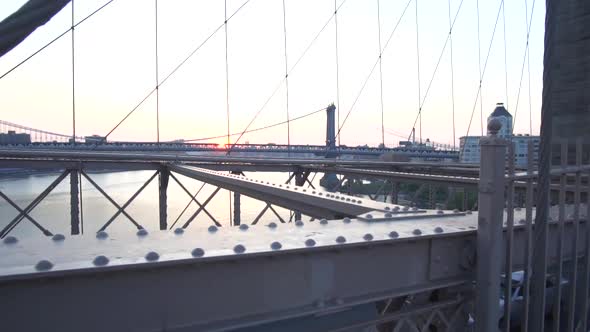 On Brooklyn Bridge Looking Into East River No People with Cars, Traffic Passing the Bridge Summer