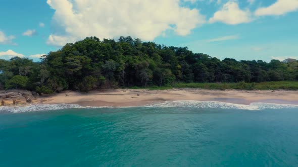 Drone footage of a wonderful island with a beautiful beach, lateral movement