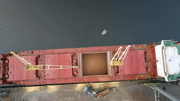 Cargo ship loading sand aerial view