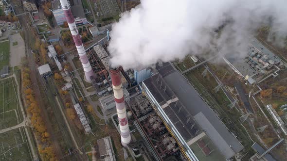 State District Power Station Aerial View. Steam Comes From a High Factory Chimney.