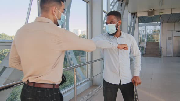 Afro American Business Man Wears Medical Face Mask Holds Folder with Documents Walks in Corridor in