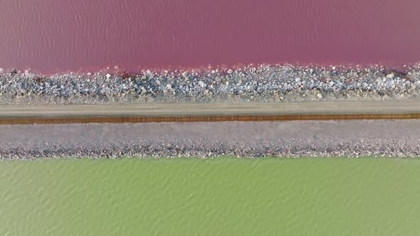 AERIAL - Railway, Lucin Cutoff, purple green Great Salt Lake, Utah, top down right to left