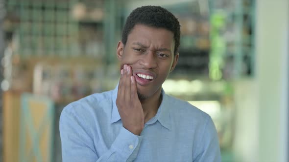 Portrait of Sick Young African Man Having Toothache