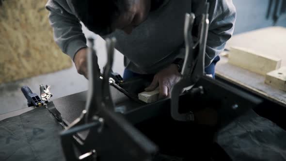 Close Up Pf a Tinsmith Blacksmith Hands Use Hammer Working in His Workshop