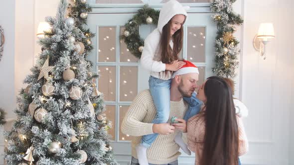 Family Decorating a Christmas Tree