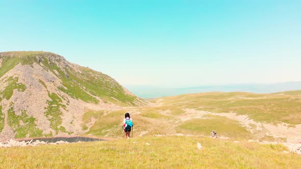 Woman Hikes In Caucasus Mountains