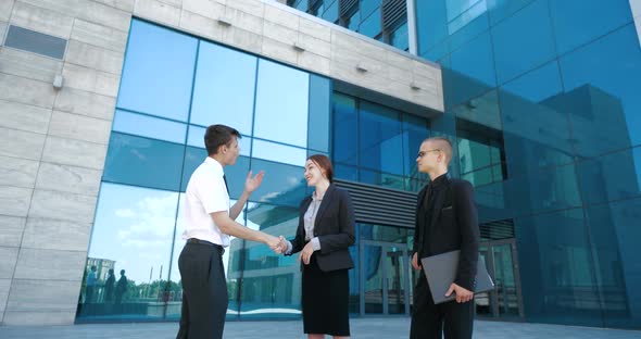 Three People Business Partner Discuss Job Problem at Informal Meeting in Open Air, Talk About Work