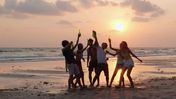 Silhouette of young party on the beach