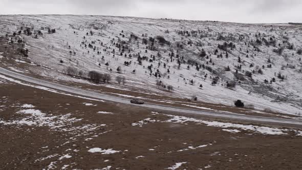 Car in the Mountains of the Caucasus in Winter