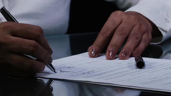Latino Woman Signs Contract 