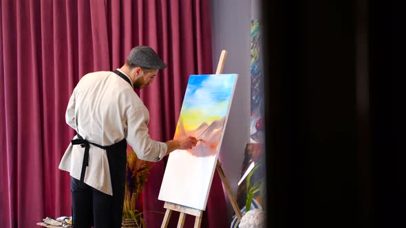 The painter is preparing an oil painting.