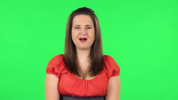 Portrait of Frustrated Girl Saying Oh My God and Being Shocked. Green Screen