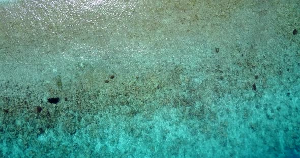 Beautiful birds eye copy space shot of a summer white paradise sand beach and aqua blue water backgr