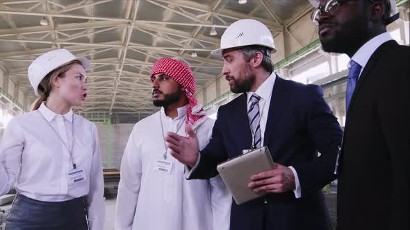 Engineers arrange an excursion at building to international colleagues