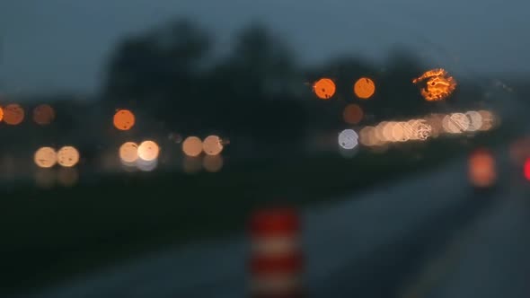 Hard Rain Fall at Night with Blurry Cars Selective Focus