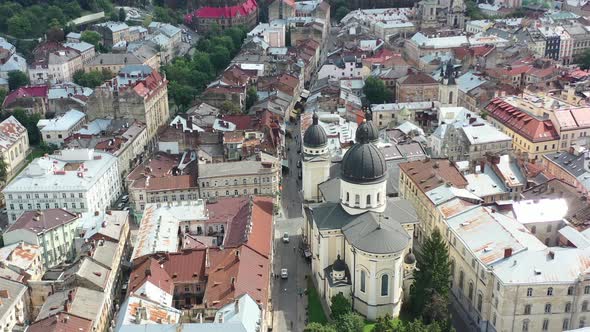 Aerial drone of a cathedral in downtown Lviv Ukraine surrounded by old historical European buildings