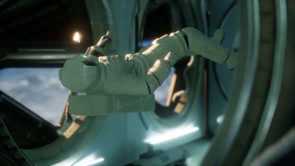 Astronaut Inside the Orbital Space Station alt